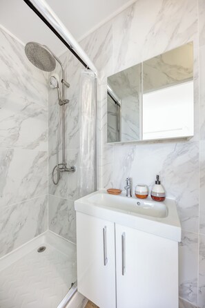 Shower, hair dryer, towels, soap