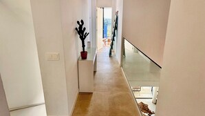 A modern interior with a hallway leading to a balcony. - Villa - Sleeps 8 - Near Beaches Golf and Polo (San Roque)