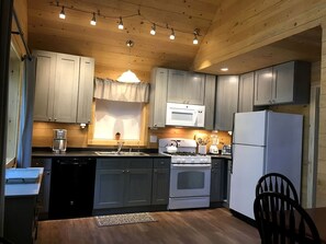 Fridge, microwave, oven, stovetop - Impressive Cottage with Fire Pit and Lake Access in Orland, Maine (Orland)