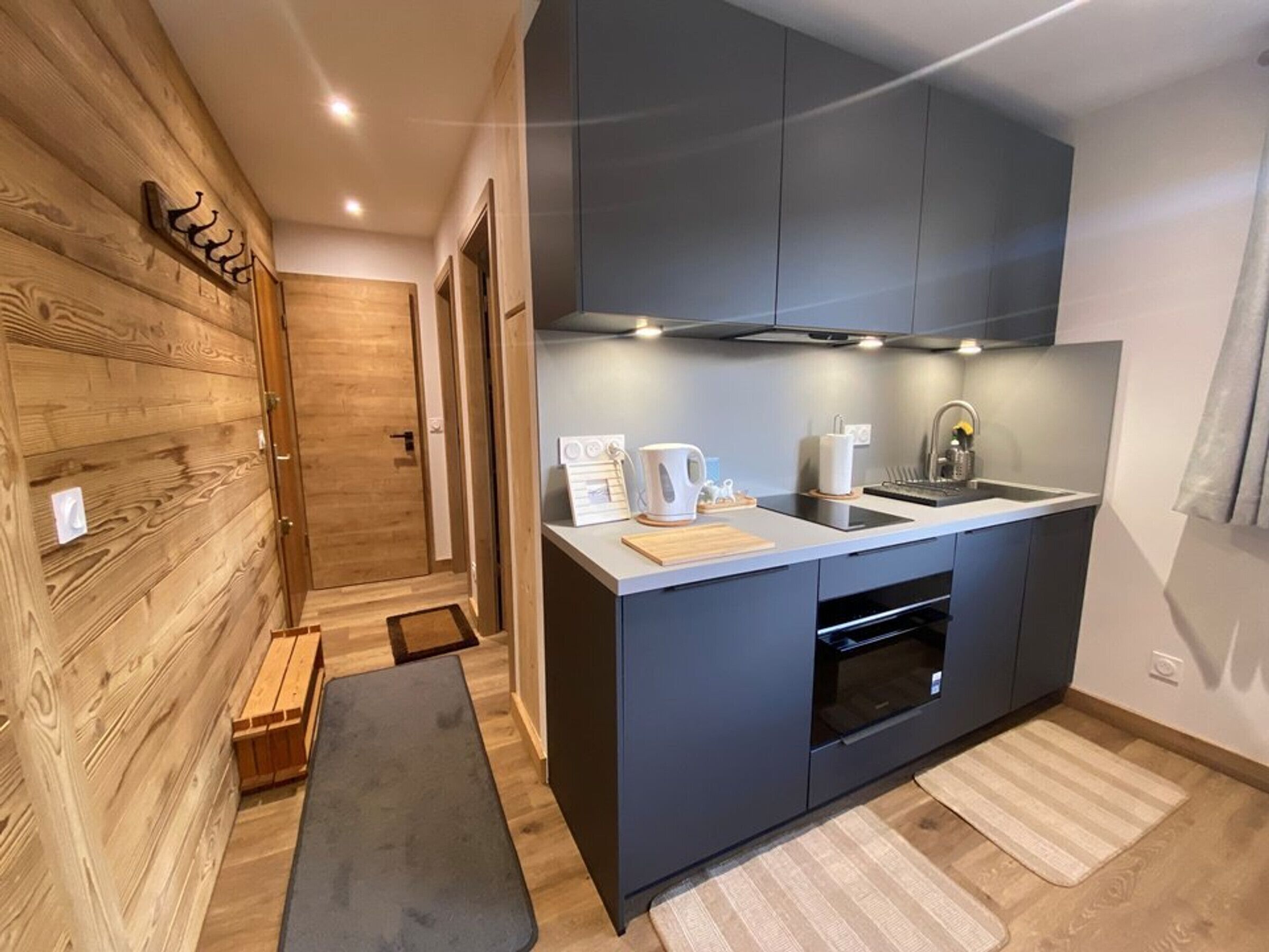 Fridge, stovetop, dishwasher, coffee/tea maker