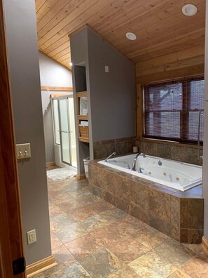 Jetted tub, hair dryer, towels, soap