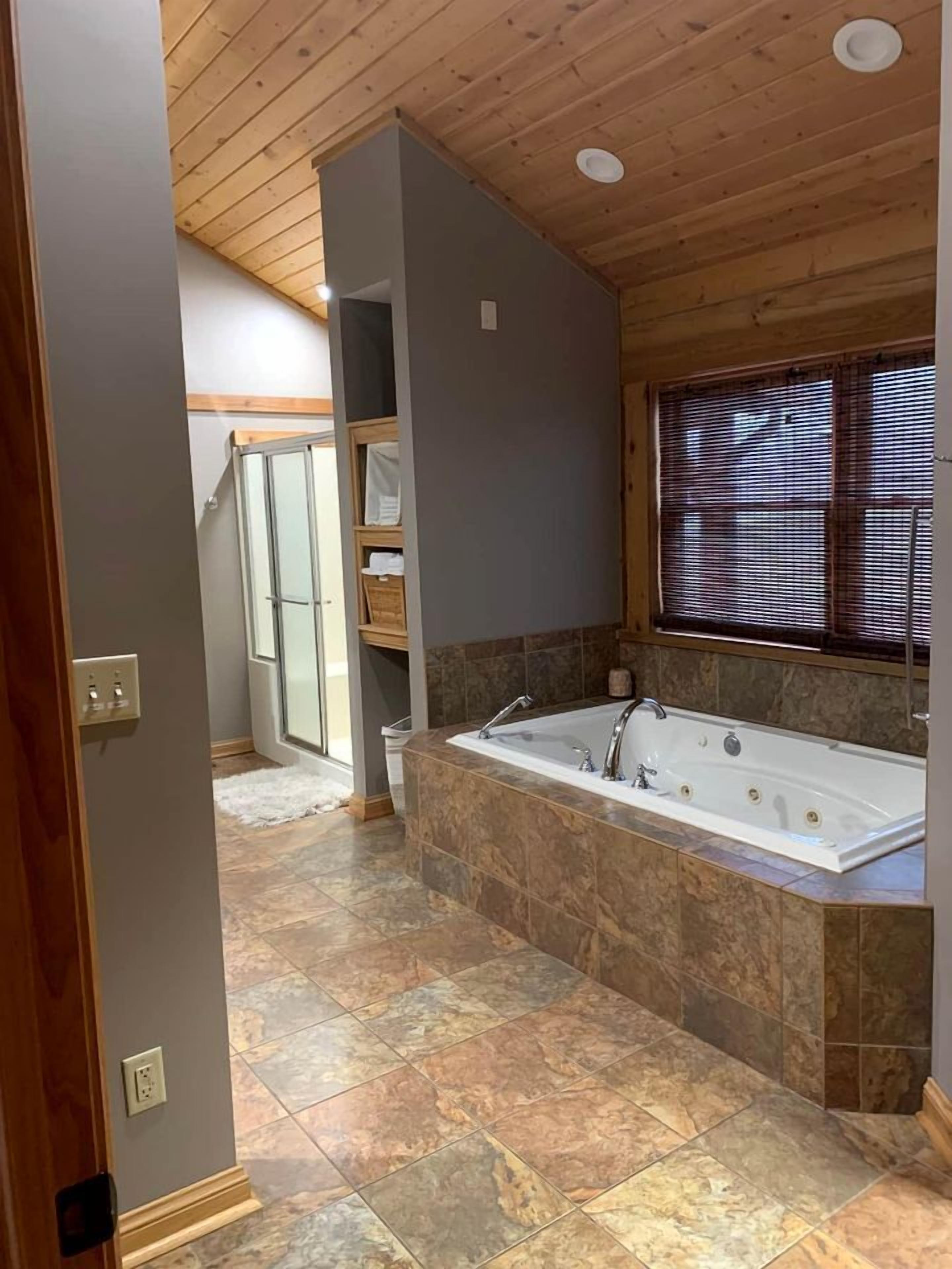 Jetted tub, hair dryer, towels, soap