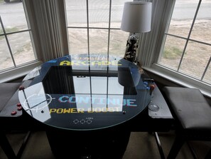 A gaming arcade table with a glass top, control buttons, and a joystick. - Cabin Retreat for Nature and City Exploration near Sebago Lake State Park, ME (Casco)