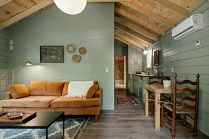 Living area - Charming Cabin Rental with Stream Access for Romantic Getaways near Pigeon Forge, Tennessee (Cosby)