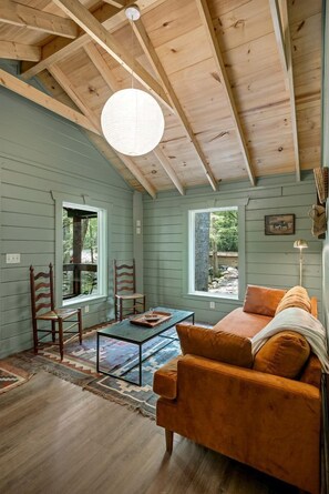 Living area - Charming Cabin Rental with Stream Access for Romantic Getaways near Pigeon Forge, Tennessee (Cosby)