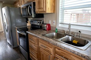 Fridge, microwave, stovetop, coffee/tea maker