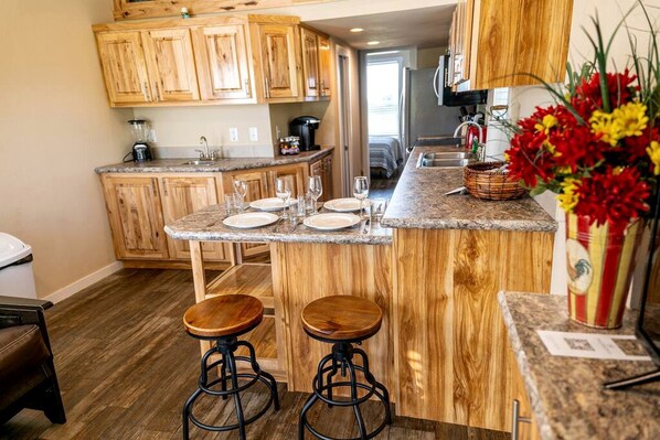 Fridge, microwave, stovetop, coffee/tea maker