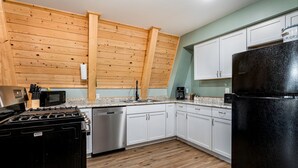 Coffee/tea maker, fridge, microwave, oven - Lofted A-Frame Cabin with Direct Lake Access and Equipped Deck in Michigan (Au Gres)