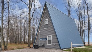A triangular building with a sign reading 'Nature's Nest.'