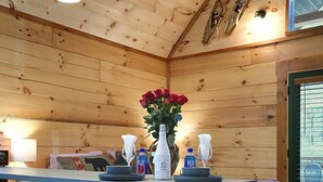 A wooden interior with a dining table, chairs, and a bench. - Stunning Cabin Nestled Amidst Trees with Hot-tub in Sevierville, Tennessee (Sevierville)