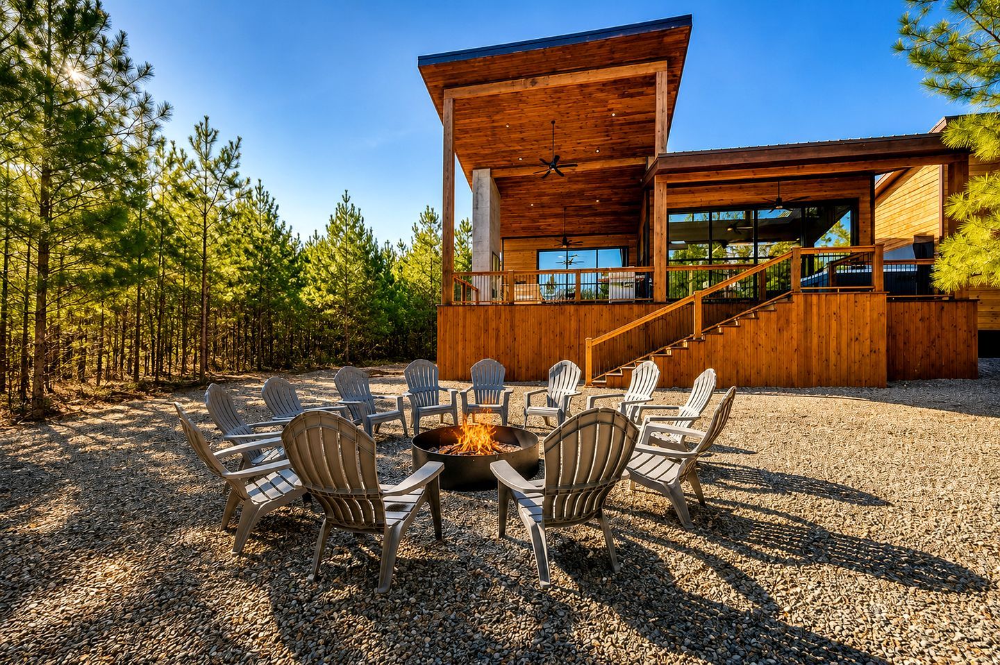 A modern wooden building with a fire pit and outdoor seating.