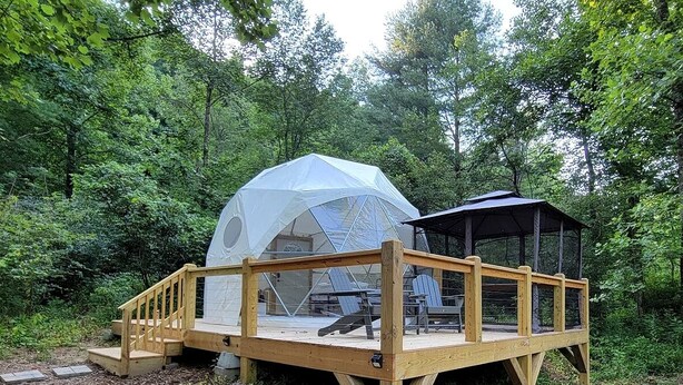 A wooden deck with a covered seating area and a gazebo. - Geodome on Creek, Great Getaway, WIFI & Hot Shower near Boone, NC (Purlear)