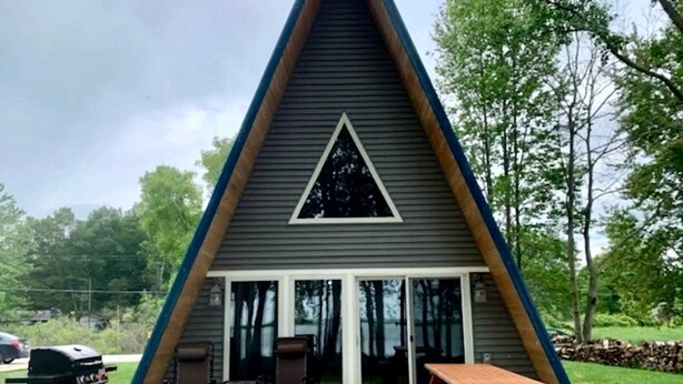Unclassified image, 1 of 31, button - Lakefront A-Frame with Lofted Interior Ideal for Outdoor Activities in Michigan (Au Gres)