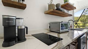 Coffee/tea maker, fridge, stovetop, toaster