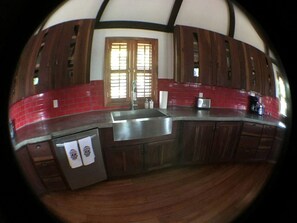 Fridge, stovetop, dishwasher, coffee/tea maker