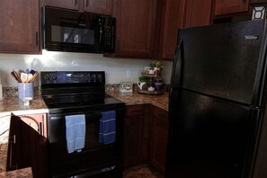 Fridge, microwave, stovetop, coffee/tea maker