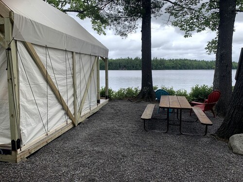 Pet-Friendly Glamping Vacations at this Waterfront Safari Tent in Naples, Maine
