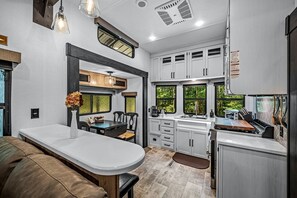 Fridge, microwave, stovetop, coffee/tea maker