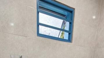 Shower, towels, soap, toilet paper