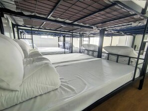 A bunk bed room with metal railings, white bedding, and a tiled ceiling. - Capital O 91243 Bee Good Chalet (Kampung Kelewang Jatoh)