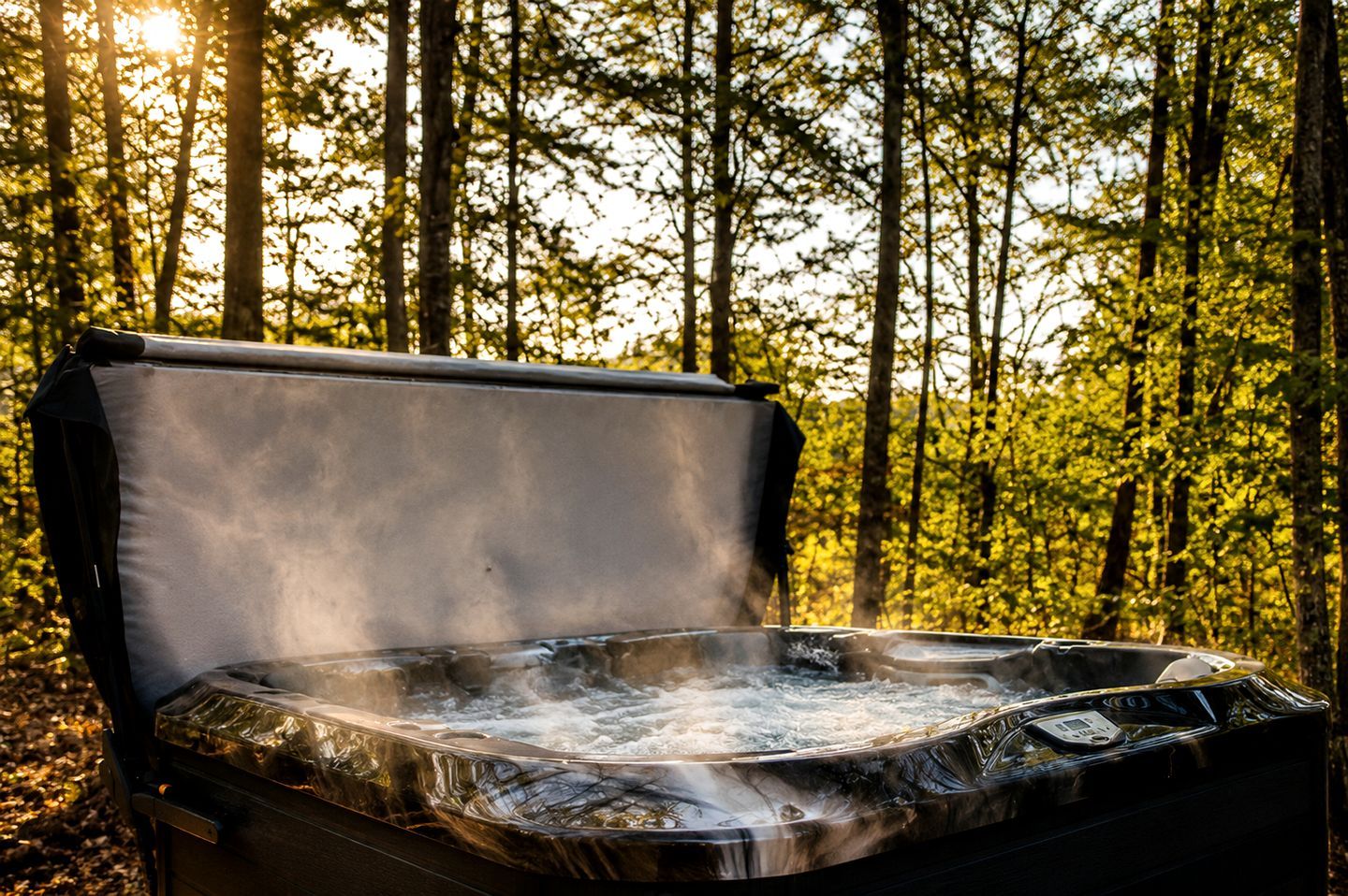 A hot tub in an outdoor setting surrounded by trees.