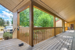 A wooden deck with a railing, a parked car, and a bicycle. - 4 Mi to Dtwn: Pagosa Springs Gem w/ Mtn Views! (Pagosa Springs)