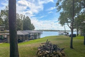 A lakeside property with a covered dock, outdoor seating, and a stone fire pit. - Lake Athens! Updated Home Water Access (Athens)
