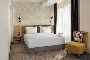 Deluxe suite, uitzicht op tuin | Een kluis op de kamer, verduisterende gordijnen