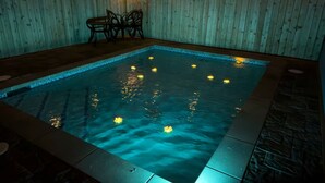 An indoor swimming pool with a wooden wall and a tiled floor. - 200 Steps To Beach Private Pool 2 Big Levels 3 Bedroom Apts (South Padre Island)