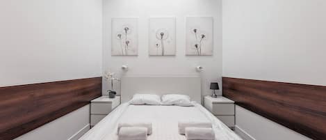 Ropa de cama hipoalergénica y tabla de planchar con plancha