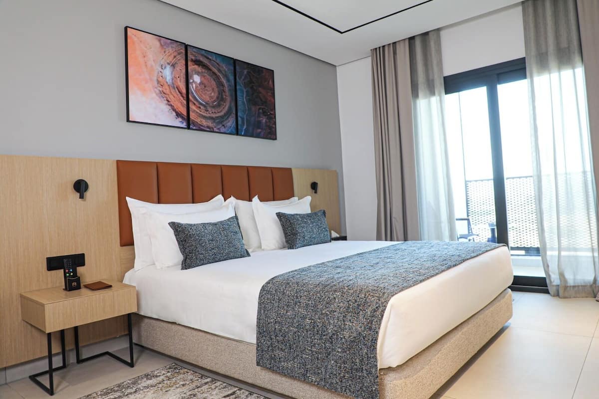 Deluxe Double Room, Balcony, City View | In-room safe, desk, blackout drapes, iron/ironing board