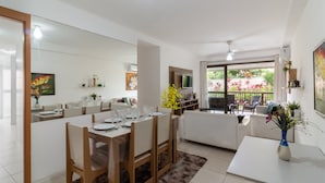 A modern kitchen with a dining area, a living room, and a balcony with outdoor seating. - 5 minutes from Macumba Beach | ZV101 (Rio de Janeiro)