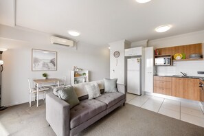 Living room - Birtinya 1-bed With Canal Views and Pool (Sunshine Coast)