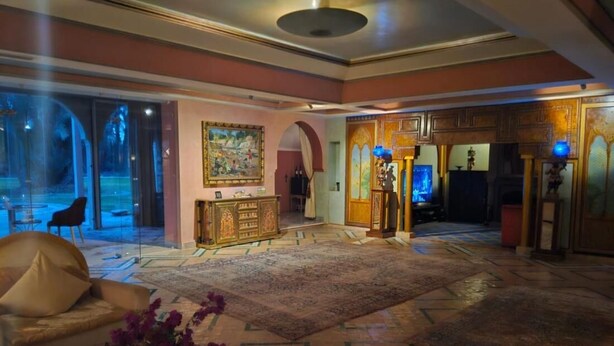 A spacious lobby with a large seating area, a reception desk, and a decorative fountain. - Palmeraie Villa in Marrakech (Marrakech)