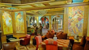 A hotel lobby with ornate decor, multiple seating areas, and a central chandelier. - Palmeraie Villa in Marrakech (Marrakech)