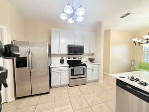 Fridge, microwave, oven, stovetop - Tranquil Naples Getaway 4BR Home with Pool, Spa Orchard & Pond near Hospitals & (Naples)