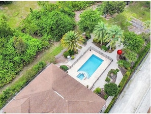 Exterior - Tranquil Naples Getaway 4BR Home with Pool, Spa Orchard & Pond near Hospitals & (Naples)