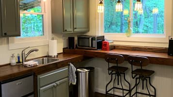 Microwave, coffee/tea maker, toaster, cookware/dishes/utensils