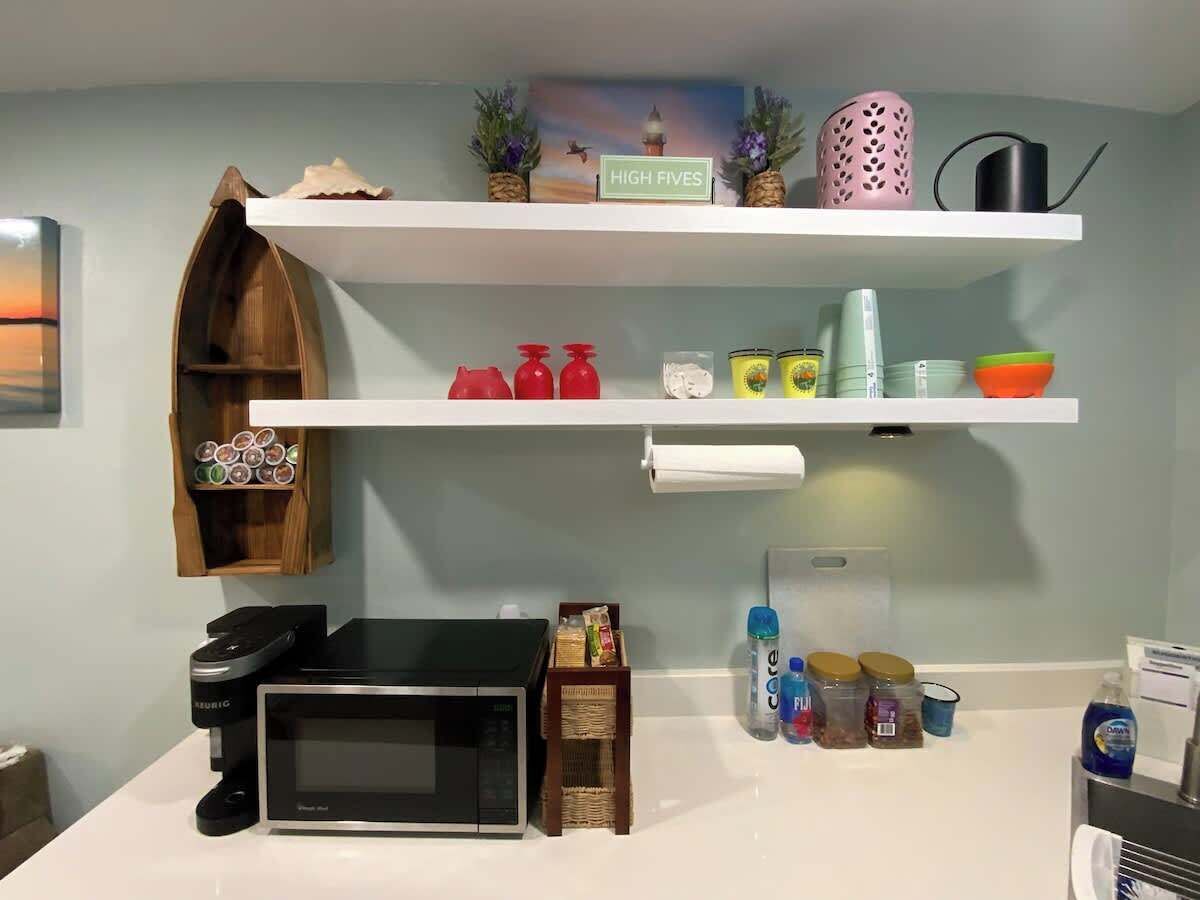 Fridge, microwave, coffee/tea maker, cookware/dishes/utensils