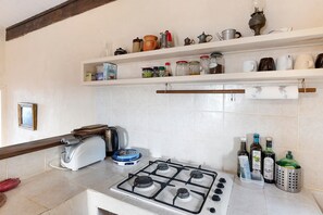 Fridge, microwave, stovetop, coffee/tea maker