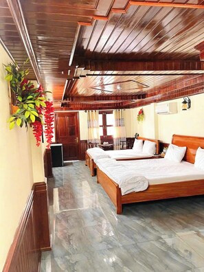 Deluxe Quadruple Room, Balcony, City View | In-room safe, blackout drapes, soundproofing, iron/ironing board