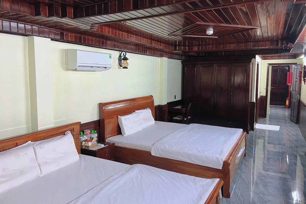 Deluxe Quadruple Room, Balcony, City View | In-room safe, blackout drapes, soundproofing, iron/ironing board