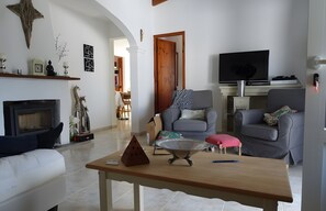 TV, fireplace - Villa 'Abrils' with Sea Views, Private Pool and Wi-Fi (Cala en Porter)