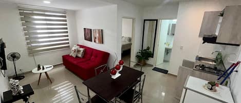 Comfort Apartment | Living area | 42-inch Smart TV with satellite channels
