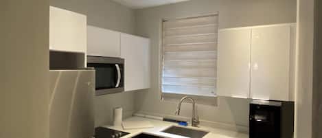 Fridge, microwave, stovetop, coffee/tea maker