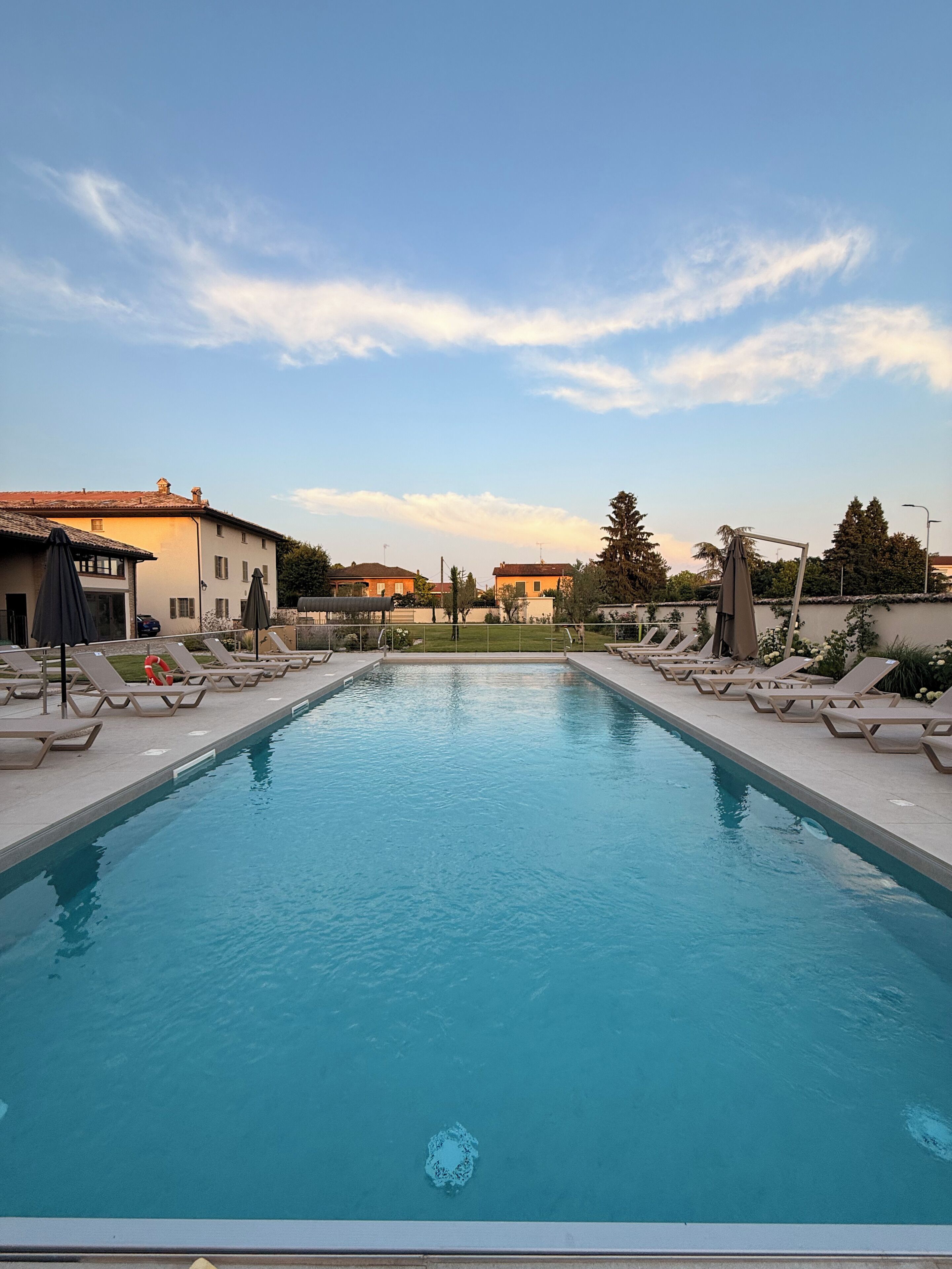 Seasonal outdoor pool, pool umbrellas, pool loungers
