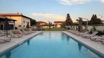 Seasonal outdoor pool, pool umbrellas, pool loungers
