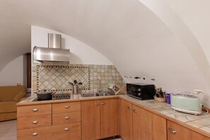 Fridge, microwave, stovetop, coffee/tea maker