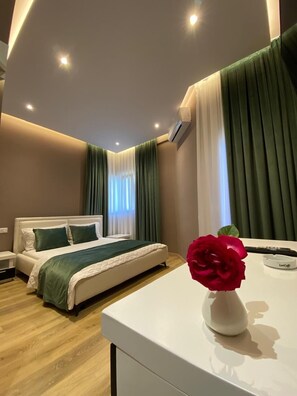 Deluxe Double Room, Balcony, City View | Down comforters, minibar, soundproofing, iron/ironing board