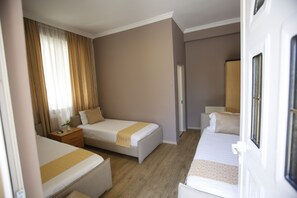 Deluxe Triple Room, City View | Soundproofing, iron/ironing board, free WiFi